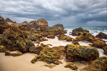 Rocks on the beach of the natural pools of Bolonia, Cadiz, Andalucia, Spain