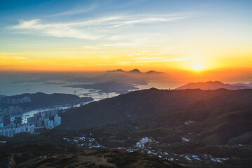 panorama of the hong kong city and mountains during sunset