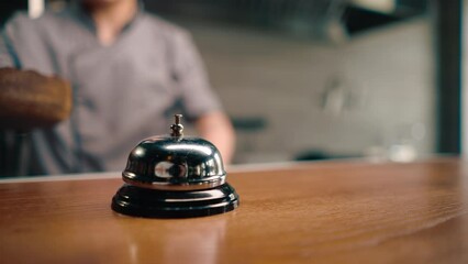 a call on the background of a professional kitchen for the cook, which is pressed when the dish is ready to notify the waiter
