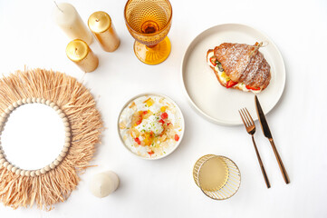 Delicious breakfast with fresh croissants and ripe berries on the white table