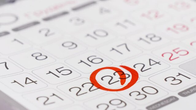 Person marks the day on the wall calendar. Important meeting or event, deadline, business appointment, visit doctor concept.