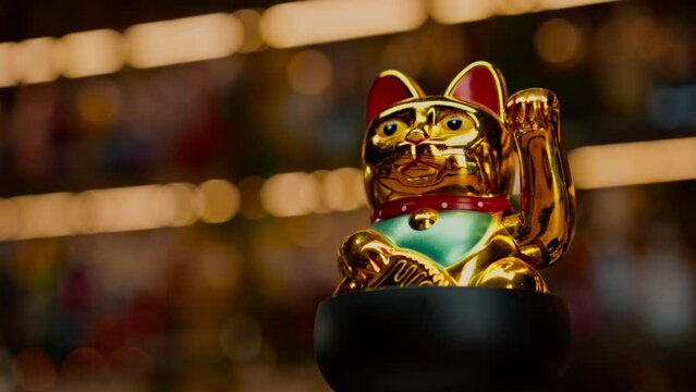 figurine of a golden money cat in a cocktail glass a good luck charm