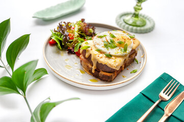 Set of breakfast dishes: croissants, toast, scrambled eggs, salad, bruschetta