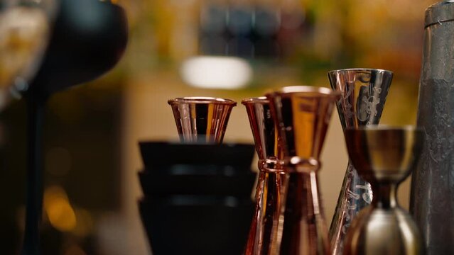 cocktail utensils jigger cocktail mixer strainer shaker on the bar concept of alcoholic beverages