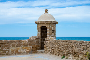 Walking on ocean promenade in Cadiz, Spain