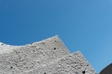 Fototapeta na wymiar concrete object close-up on an azure blue sky 