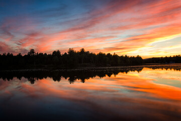 Fototapeta premium Sunset over Ulster Heights Lake, Ellenville, New York.