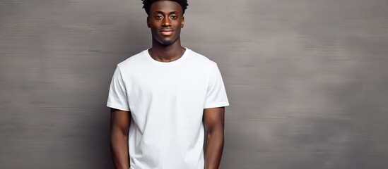 Handsome young African American student with black denim pants and blank white T shirt for text or advertising