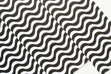 Obraz premium black and white paper with wavy lines layered on blank paper