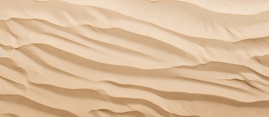 Fototapeta na wymiar Beach background with light beige sand texture