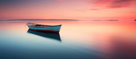 Papier Peint photo Réflexion Boat on lake with sunset reflection Slow Shutter captures Motion Blur and Soft Focus