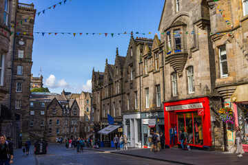 street in Edinburgh old town scottish tourist attraction colourful shops 