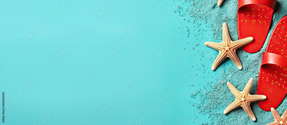 Aufkleber Top view mock up of beach accessories including flip flops and starfish on a colored background with space for text