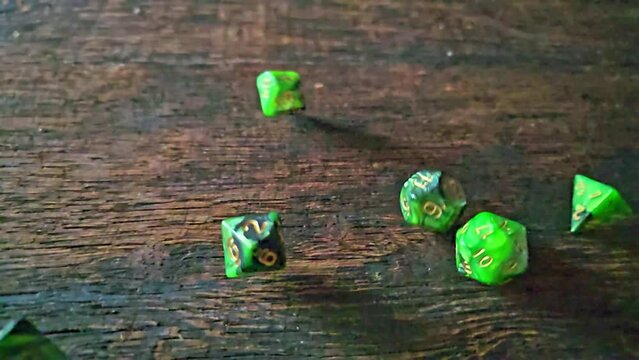 RPG dice, RPG game dice falling in super slow motian over rough surface, selective focus.
