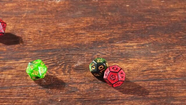 RPG dice, RPG game dice falling in super slow motian over rough surface, selective focus.