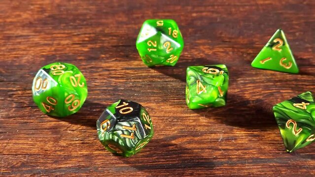 RPG dice, RPG game dice falling in super slow motian over rough surface, selective focus.