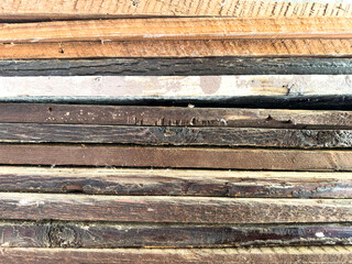 vintage retro aged weathered wood planks cut stacked lumberyard panels closeup