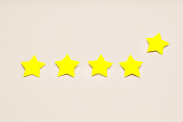 Five stars on light background. Customer experience concept