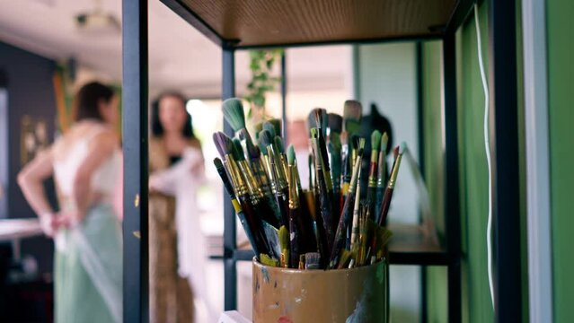 Close-up of a brush stand standing in a painting studio concept of love for fine art and painting 