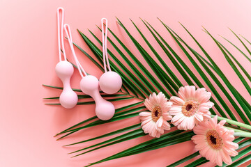 Pink balls for special exercises for woman. Balls for intimate muscles of women. Kegel balls for strenthening the pelvic floor muscles, vaginal muscles. Mock up. Close up