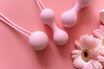Pink balls for special exercises for woman. Balls for intimate muscles of women. Kegel balls for strenthening the pelvic floor muscles, vaginal muscles. Mock up. Close up