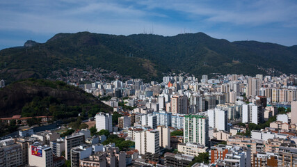 Aerial view of the urban area of the North Zone of Rio de Janeiro and in the background the mountain range that makes up the Tijuca massif and the Tijuca National Park.