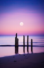 the moon rising over the ocean with two wooden posts sticking out into the water at low tide beach in dorset, england