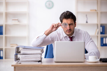 Young male employee working in the office