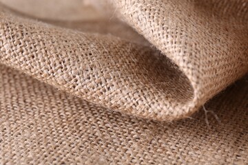 Fototapeta na wymiar Texture of beige burlap fabric, closeup view