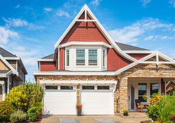 Elegant detached house with double garage. Residential house with concrete driveway and entrance door