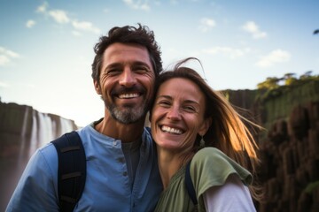 Couple in their 40s smiling at the Iguazu Falls in Misiones Argentina/Brazil