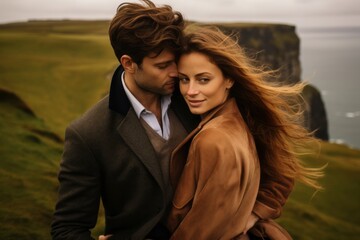 Couple in their 30s at the Cliffs of Moher in County Clare Ireland