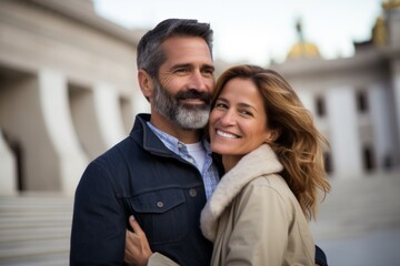 Couple in their 40s smiling at the Museo Nacional Del Prado in Madrid Spain