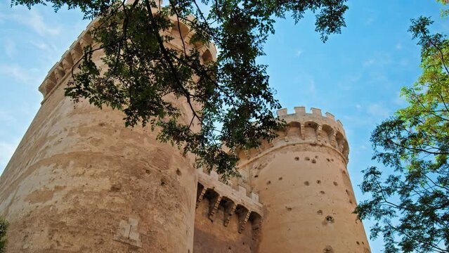 Twin gothic-style defensive Quart Towers built as part of Valencia's city wall. Beautiful view of antique historical Portal de Quart in Valencia, huge twin towers in Spain, Europe