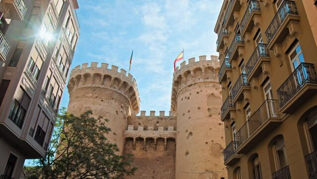 Twin gothic-style defensive Quart Towers built as part of Valencia's city wall. Beautiful view of antique historical Portal de Quart in Valencia, huge twin towers in Spain, Europe