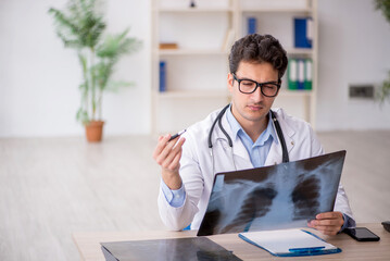 Young male doctor radiologist working in the clinic