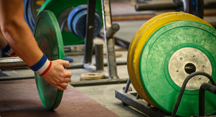 Weightlifter Loading a Barbell