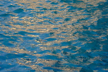 The surface of water is blue with ripples. water.