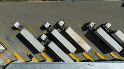 Overhead view of container trucks being loaded at cold store in Cape Town, South Africa © NAXstock