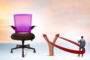 Career concept with businessman launched from slingshot