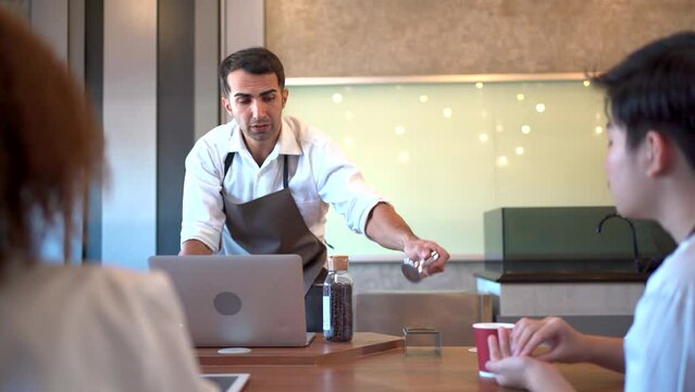 Group of barista or bartender students having a workshop how to brew and test coffee with professional - expert barista.