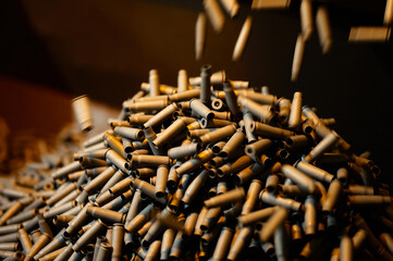 Shell casings fall down in ammunition production workshop