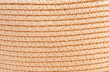 Texture of female straw hat. Close up. Top view.