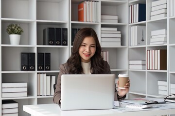 business woman working with laptop in office and drink coffee, business financial concept