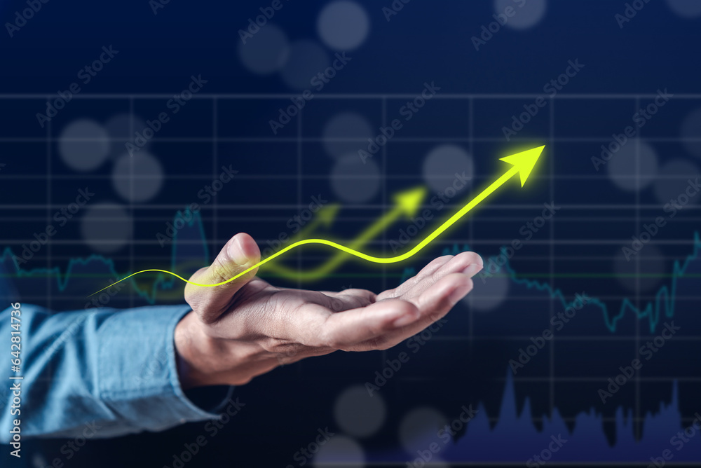 Aufkleber Business Chart Arrow Glowing on Stock market Analysis Data and Trading statistic value economic on hand index fund and money exchange business technology concept.