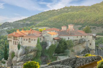 Greek Rock Monastery With Red Roofs