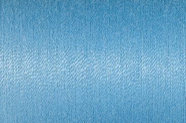 Abstract fabric texture background, close up picture of blue color thread, macro image of textile...