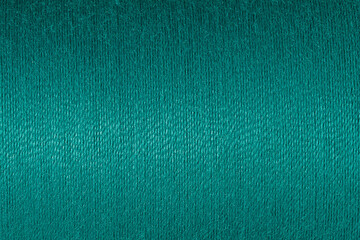 Abstract fabric texture background, close up picture of verdigris green color thread, macro image...