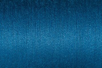Abstract fabric texture background, close up picture of purssian blue color thread, macro image of...