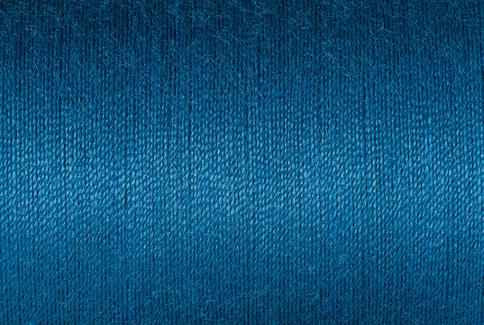 Abstract fabric texture background, close up picture of purssian blue color thread, macro image of textile surface, wallpaper template for banner, website, poster, backdrop.